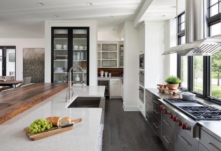 Off-white countertops with gray lower cabinets