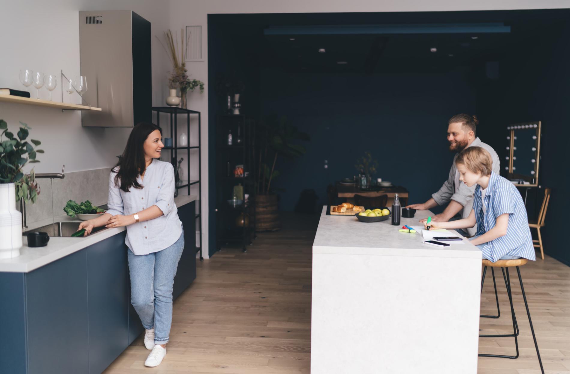 Happy family spending time together in modern basement kitchen