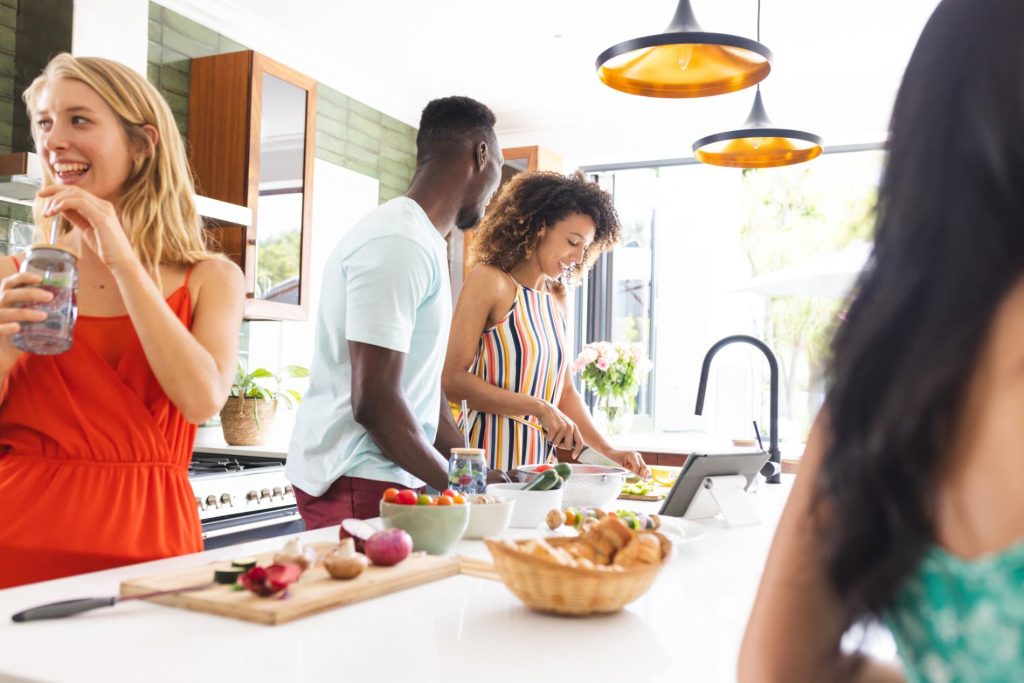 White countertop kitchen with couple during installation process